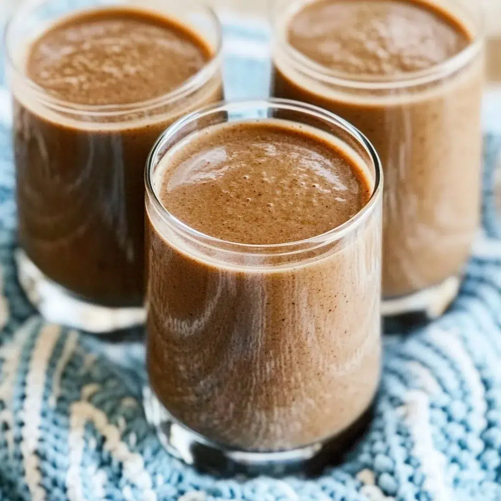 Date Coffee Breakfast Smoothie in a glass with coffee beans and dates